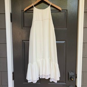 White Dress with High Neckline and Lace Details